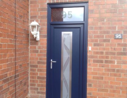 A modern navy blue composite front door with house number transom window / fanlight by Taurus Boston