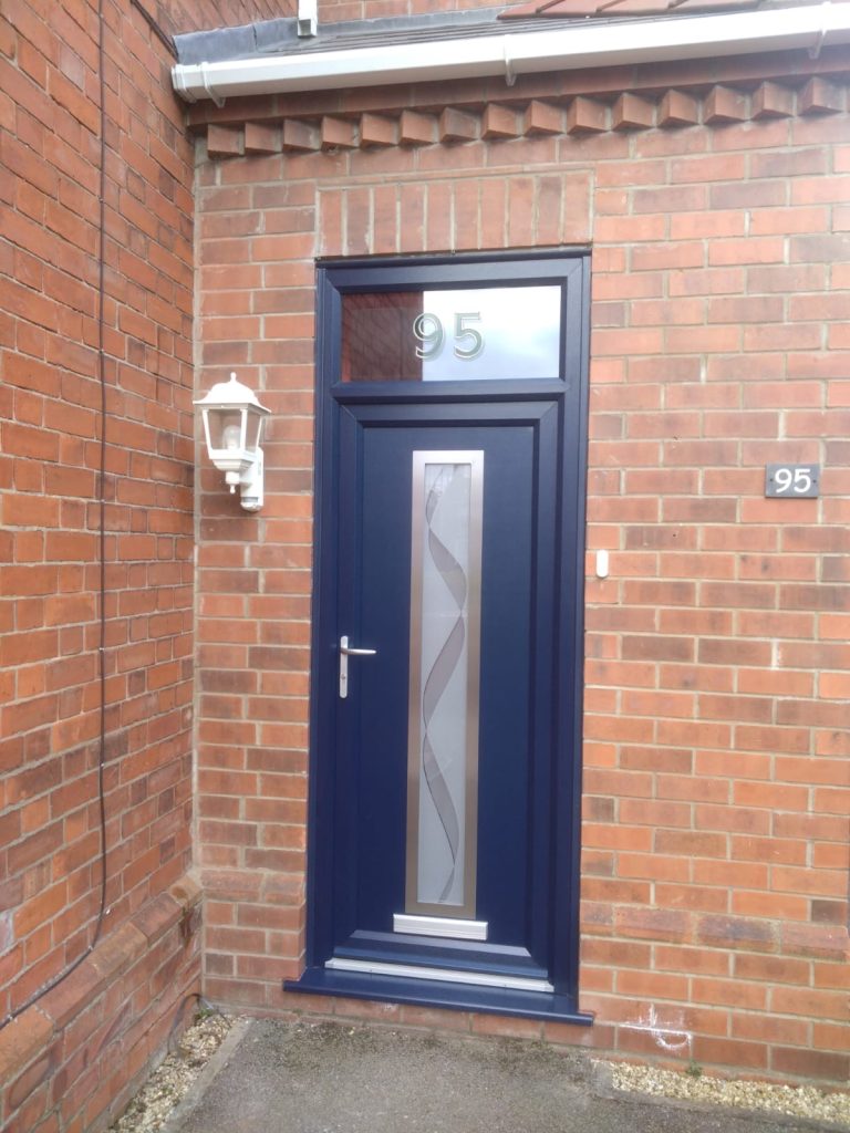 A modern navy blue composite front door with house number transom window / fanlight by Taurus Boston