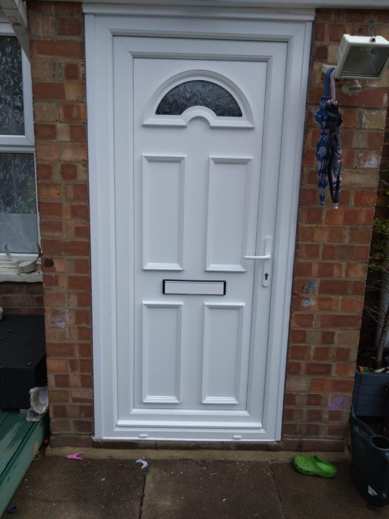 Upvc front door in white with semi-circular window