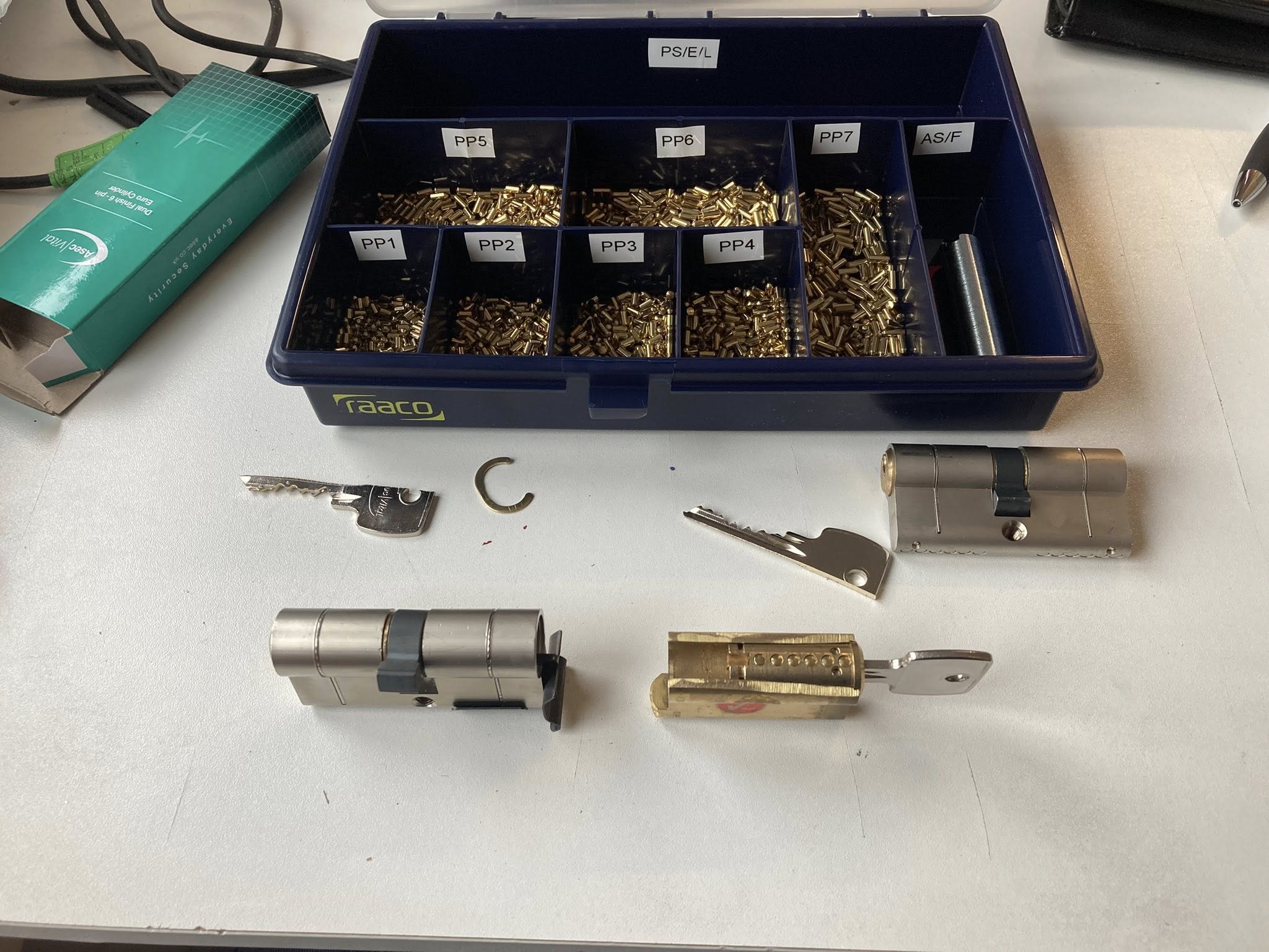 A range of door locks being re-pinned to have matching keys. By Taurus Locks and Glazing in Boston.