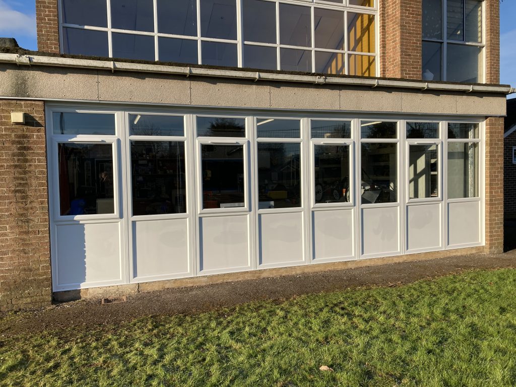New windows and panels installed at school building classroom by Taurus Boston