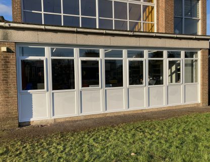 New windows and panels installed at school building classroom by Taurus Boston