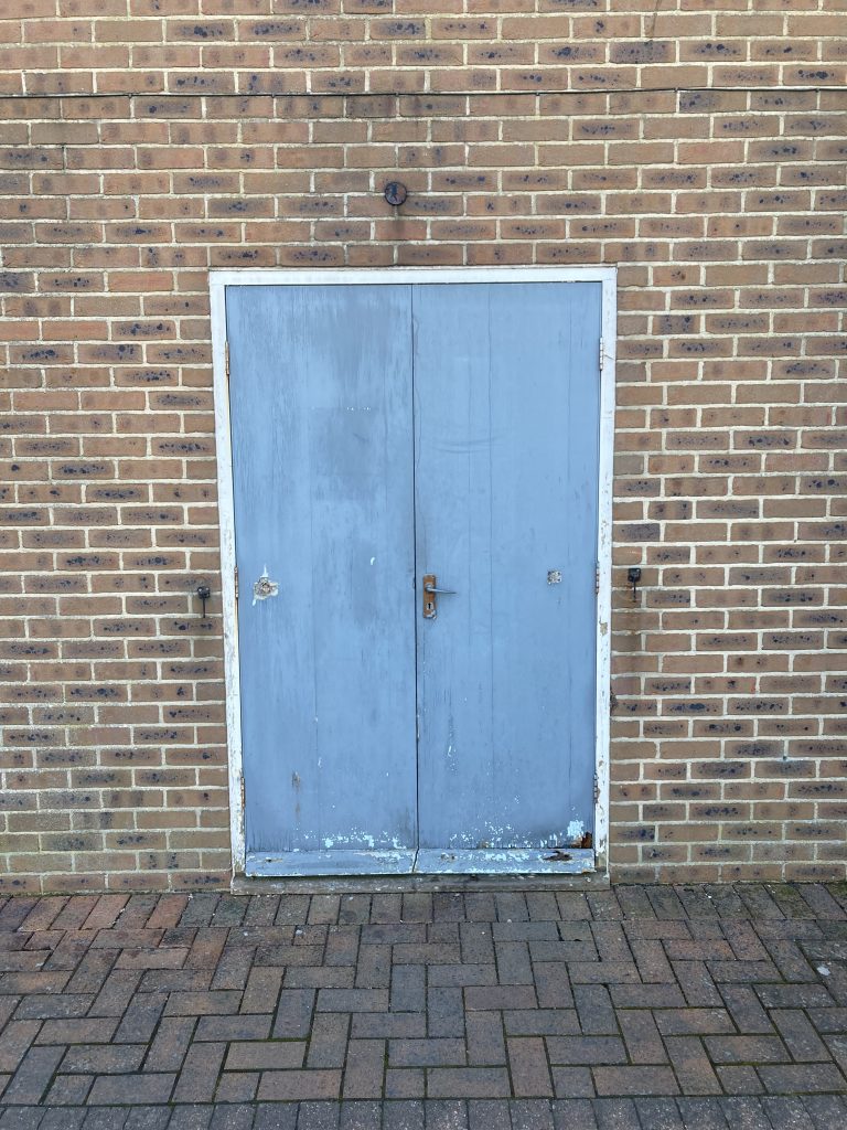 Old double doors pictured before replacement by Taurus Boston