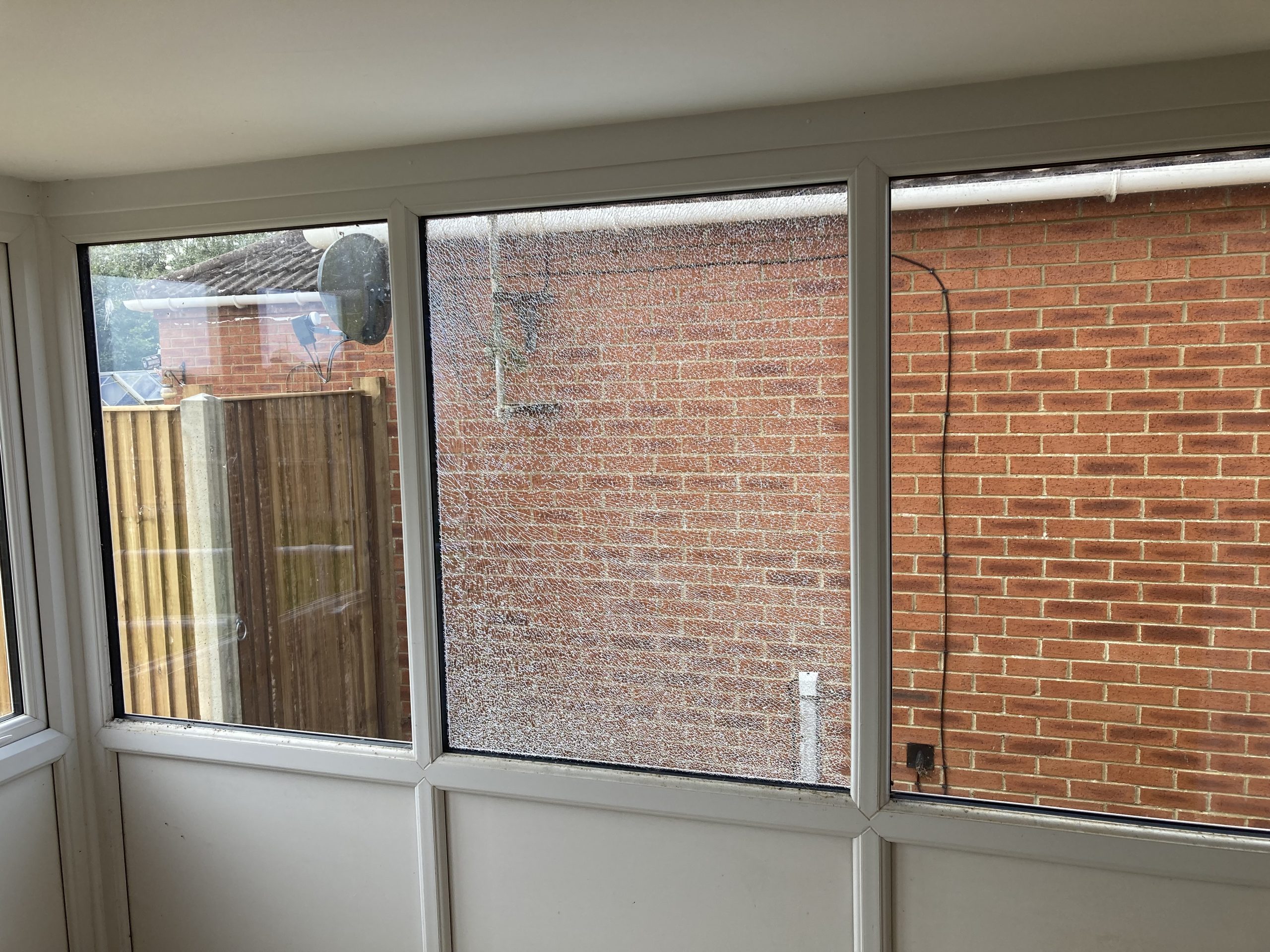 Broken window glass pane before removal and replacement