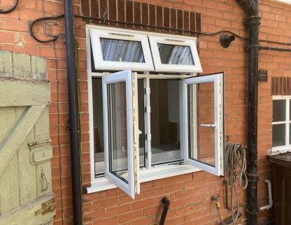 New replacement upvc double window with top window openings pictured open