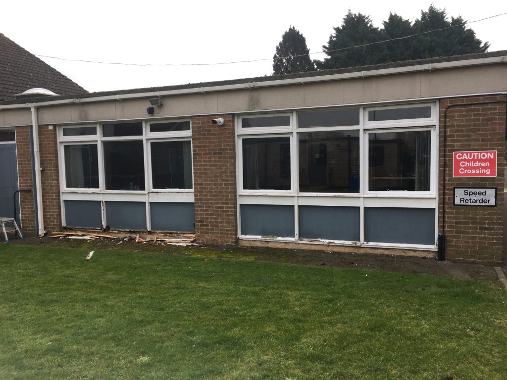 Old school building windows before removal and replacement