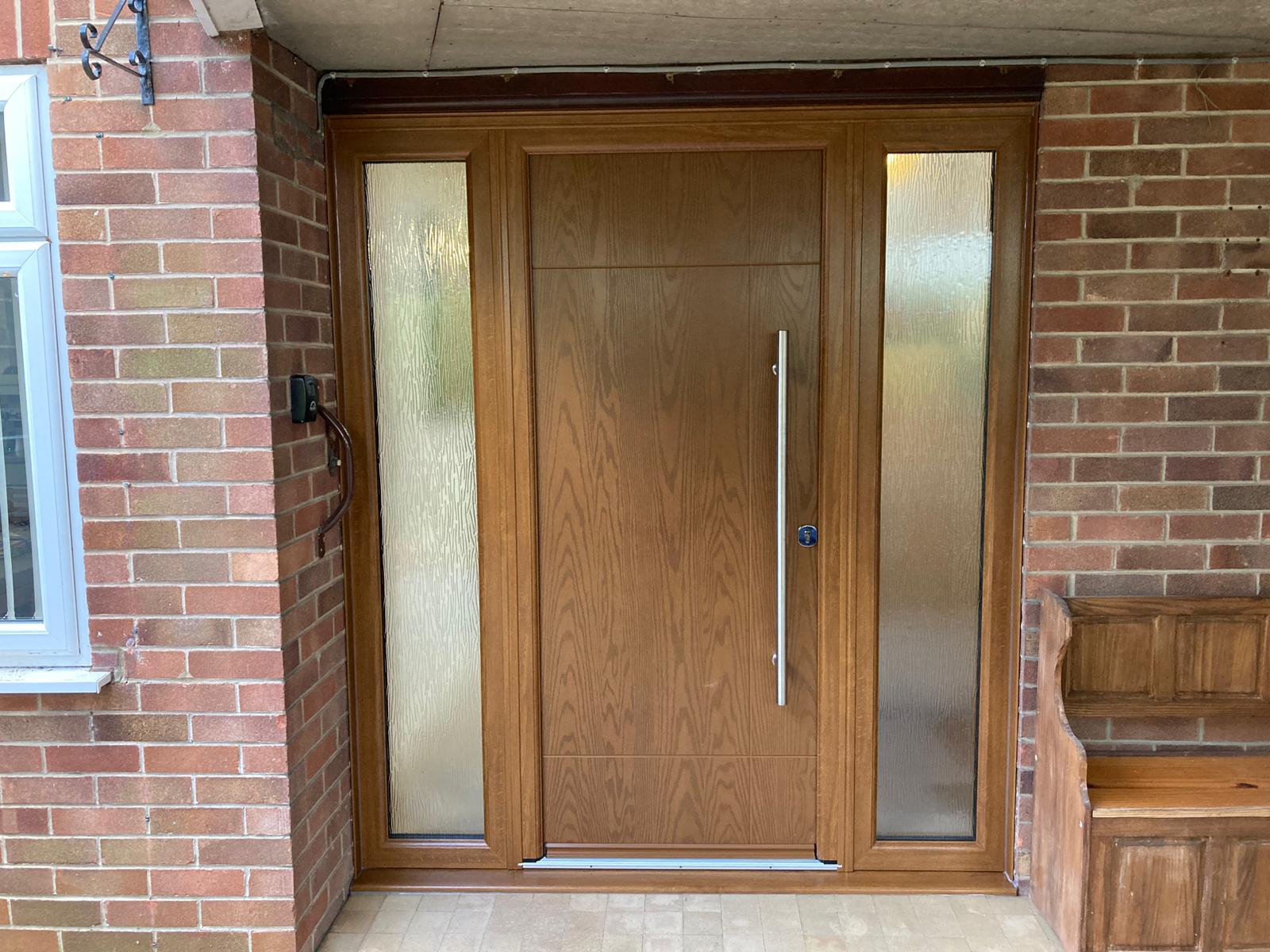 Green composite front door installation in Boston, By Taurus Locks and Glazing.